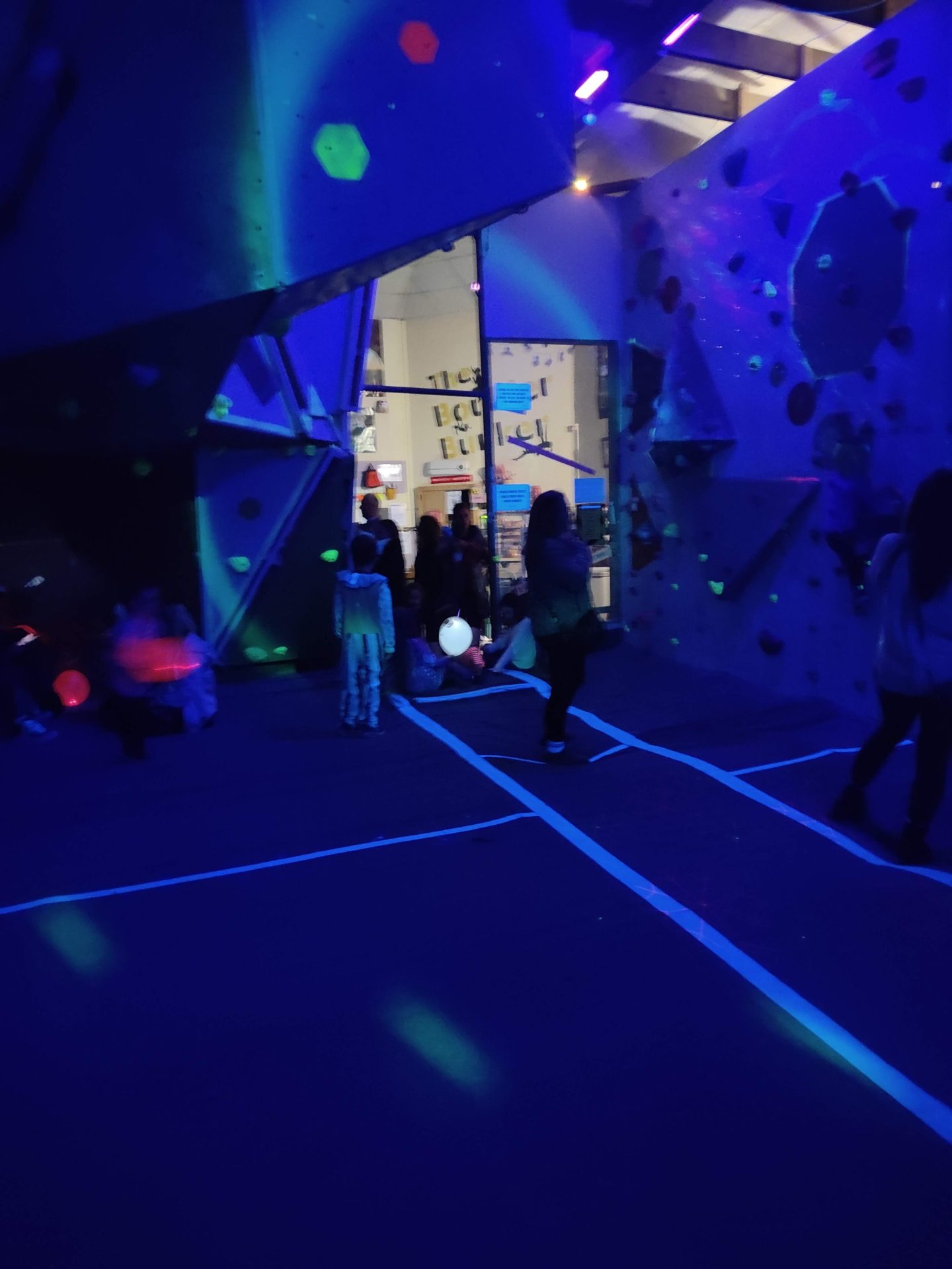 Boulderween UV climbing scene